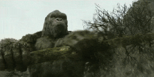 Kong using a tree as a weapon